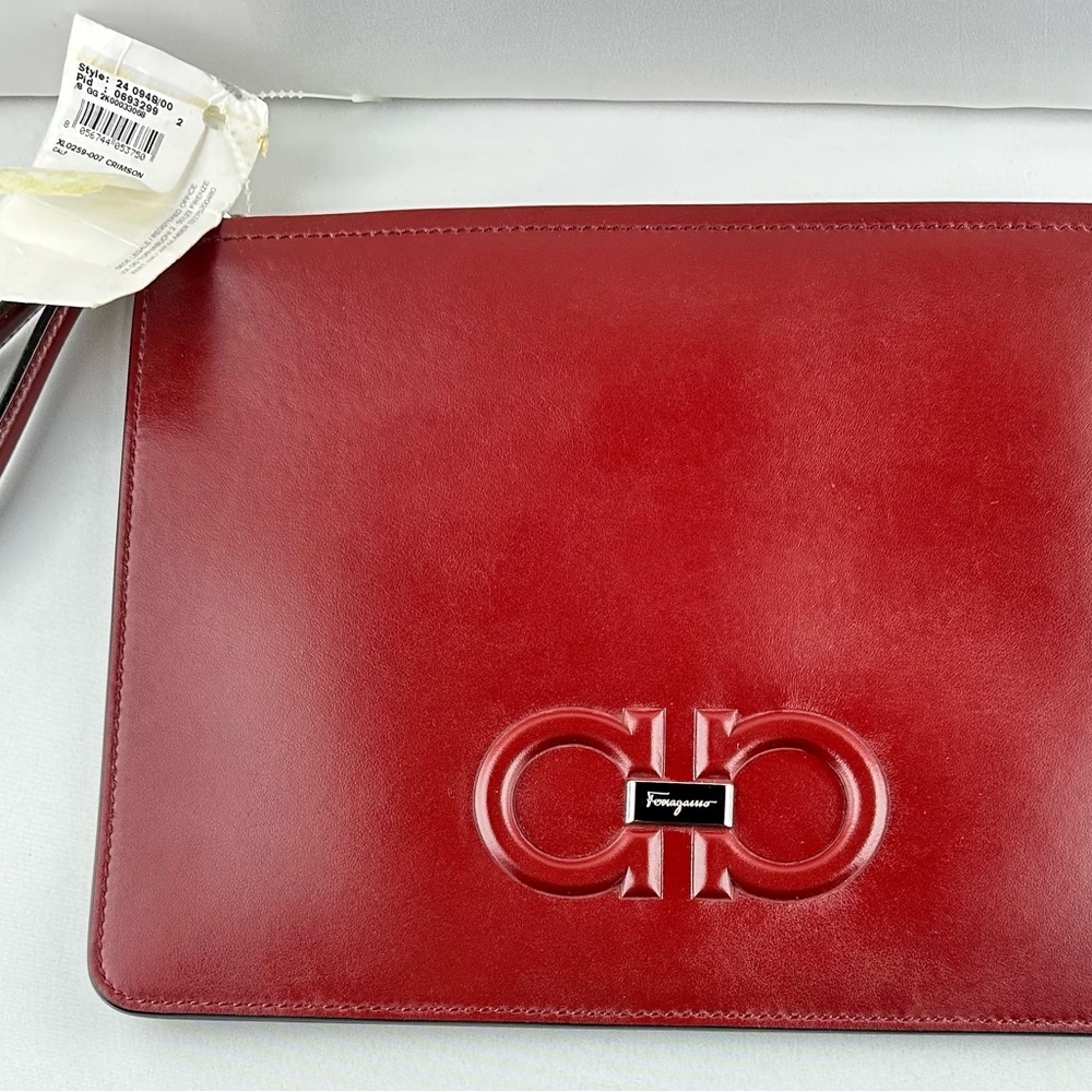 Ferragamo Logo Embossed Zipped Clutch Bag